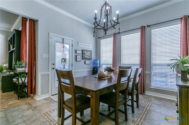 tiled dining area featuring crown molding, a wealth of natural light, and an inviting chandelier