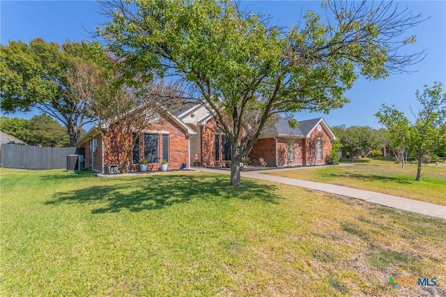 single story home featuring a front lawn and central AC