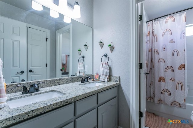 bathroom with vanity and shower / tub combo with curtain