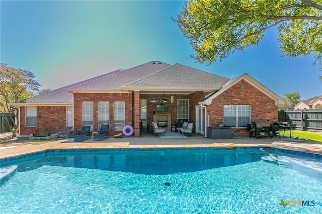 view of pool with a patio area and area for grilling