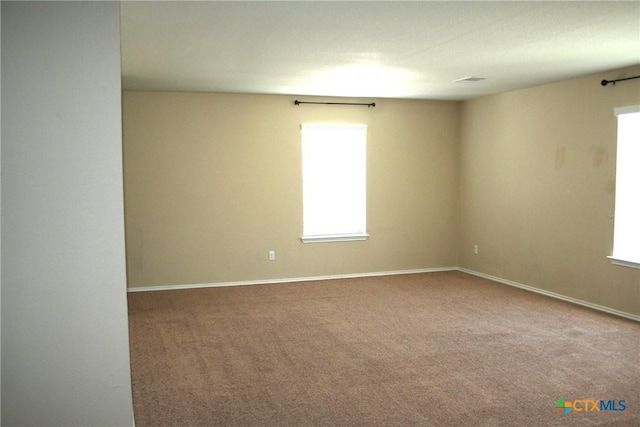 308 E Vega Ln, Killeen, TX 76542 - empty room with plenty of natural light and carpet flooring
