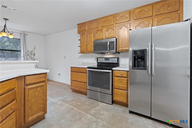 kitchen featuring decorative light fixtures, light colored carpet, appliances with stainless steel finishes, and an inviting chandelier