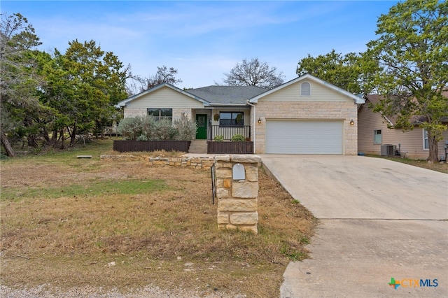 single story home with a garage and a front lawn