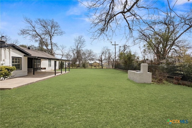 view of yard featuring a fenced backyard and a patio area