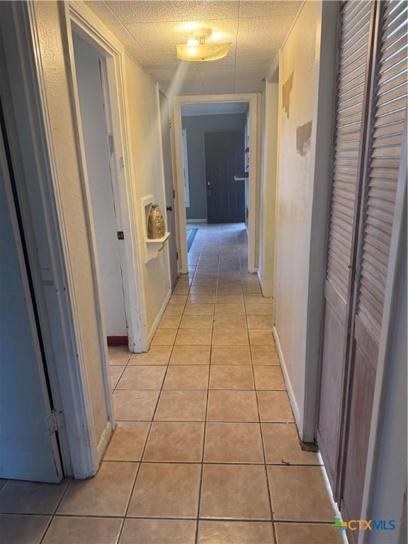 hallway with light tile patterned flooring