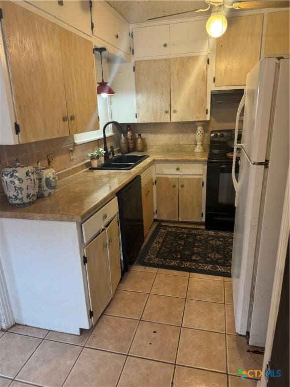 kitchen featuring light tile patterned flooring, light brown cabinetry, sink, ceiling fan, and black appliances