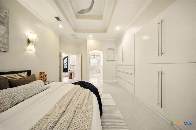 1127 Redleaf Dr, Nolanville, TX 76559 - bedroom featuring light tile patterned flooring, arched walkways, ornamental molding, recessed lighting, and a tray ceiling