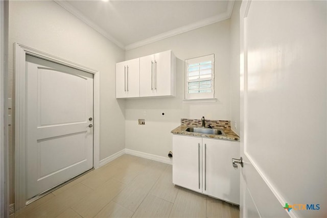 1127 Redleaf Dr, Nolanville, TX 76559 - laundry area with cabinet space, washer hookup, crown molding, electric dryer hookup, and baseboards