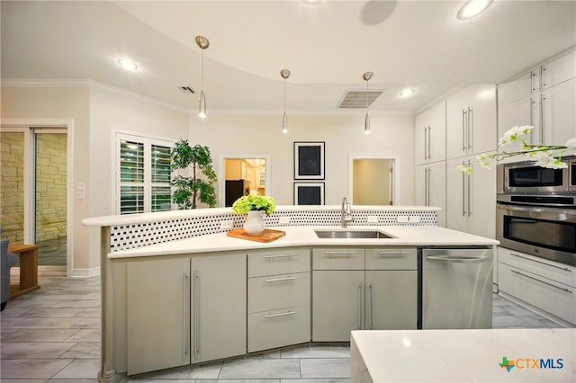 1127 Redleaf Dr, Nolanville, TX 76559 - kitchen featuring appliances with stainless steel finishes, a sink, crown molding, light countertops, and recessed lighting