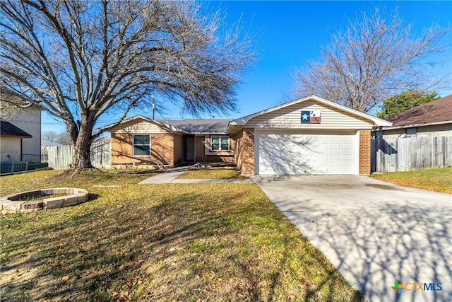 ranch-style house with a garage, central air condition unit, and a front yard