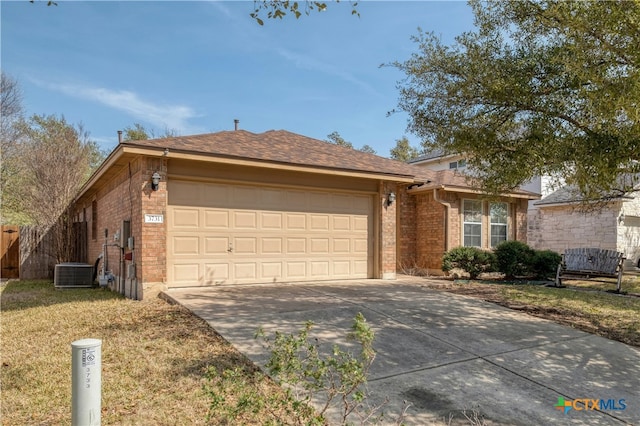 ranch-style house featuring driveway, central AC unit, an attached garage, a front lawn, and brick siding