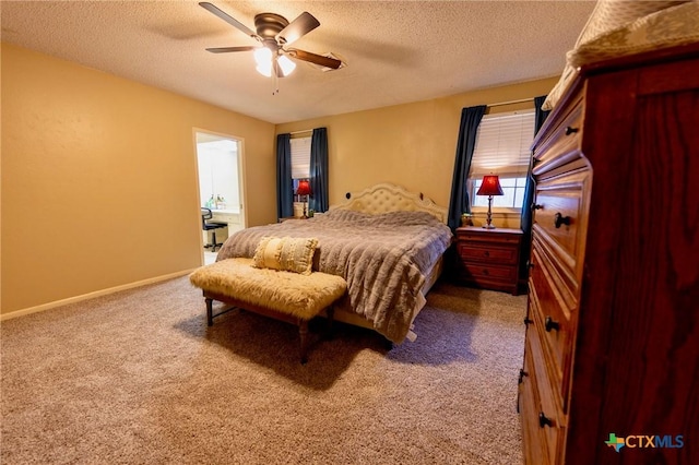 bedroom featuring ceiling fan, carpet floors, and a textured ceiling