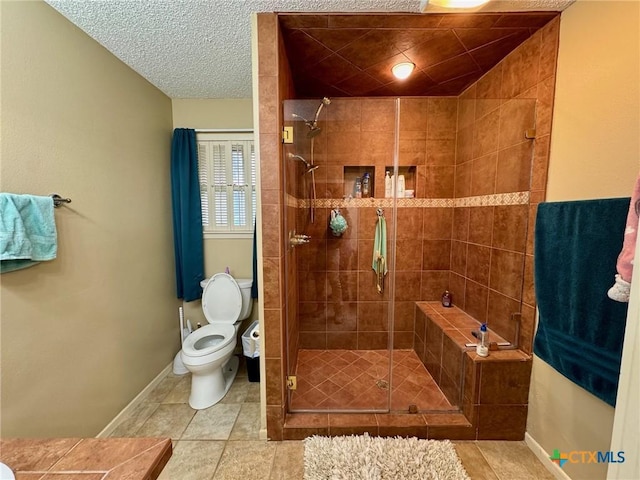 bathroom featuring tile patterned flooring, a shower with shower door, a textured ceiling, and toilet