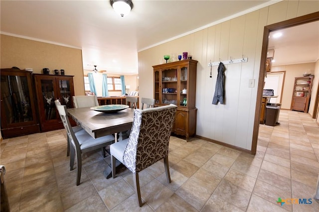 dining space featuring ornamental molding