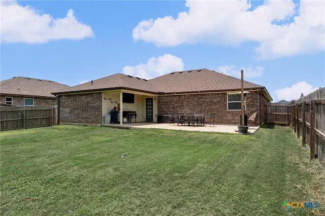 2617 Turning Creek St, Temple, TX 76504 - back of house featuring brick siding, a patio, a fenced backyard, and a shingled roof