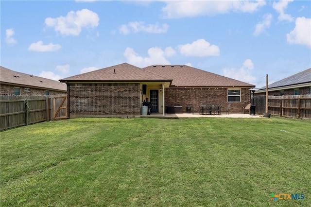 2617 Turning Creek St, Temple, TX 76504 - rear view of house with brick siding, a patio area, a shingled roof, and a fenced backyard