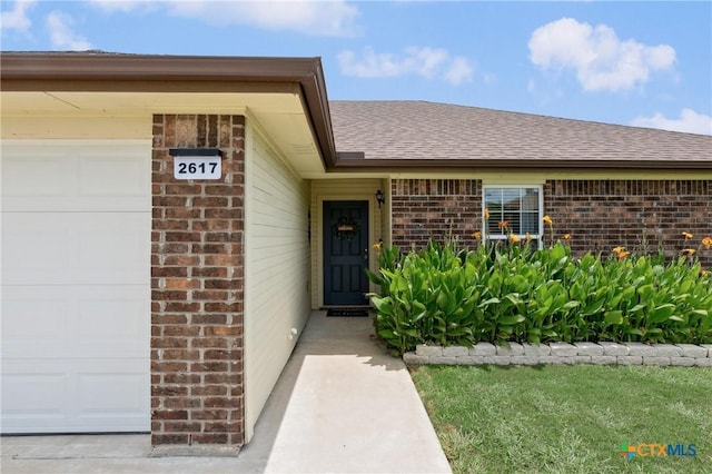 2617 Turning Creek St, Temple, TX 76504 - view of exterior entry with brick siding and a shingled roof