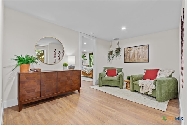 living area with light hardwood / wood-style flooring