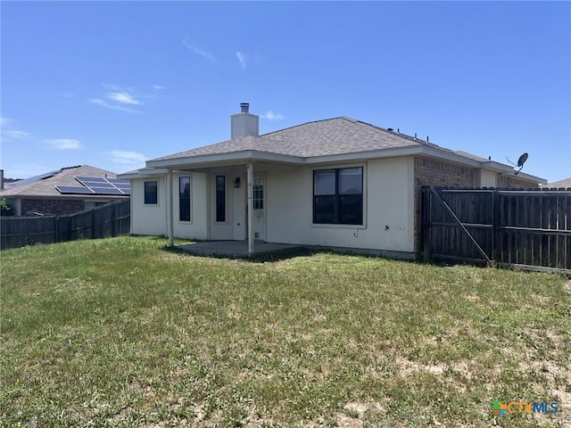 508 Redbud Dr, Copperas Cove, TX 76522 - back of property featuring a patio area, a chimney, and a shingled roof
