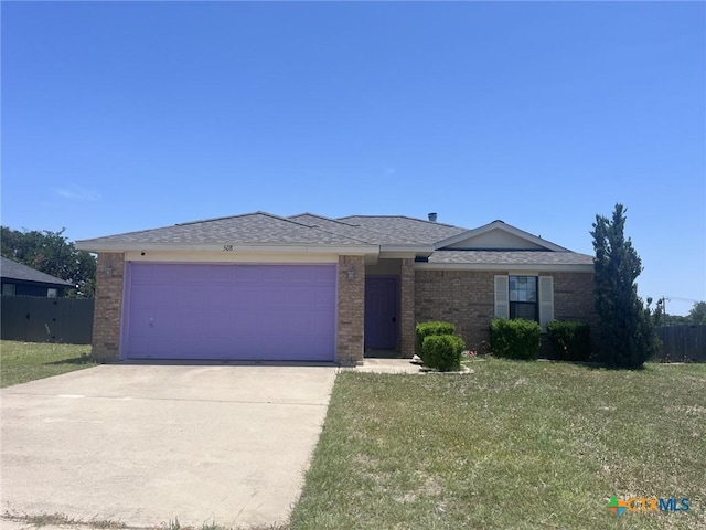 508 Redbud Dr, Copperas Cove, TX 76522 - ranch-style home featuring brick siding, driveway, a garage, and roof with shingles