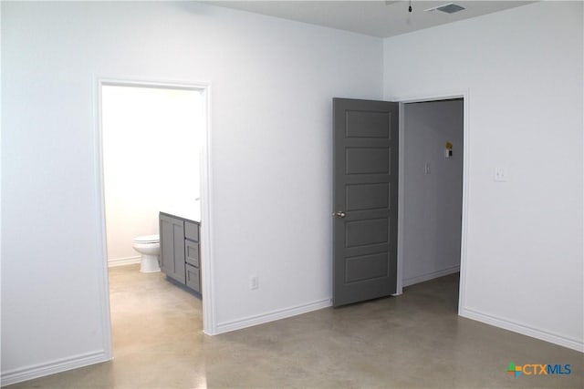 unfurnished bedroom with connected bathroom