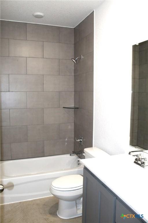 full bathroom with vanity, toilet, and tiled shower / bath