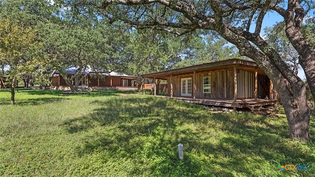 view of yard featuring a wooden deck