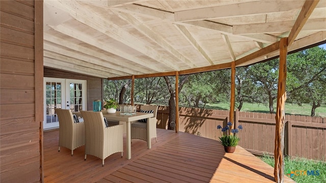 unfurnished sunroom with french doors and lofted ceiling