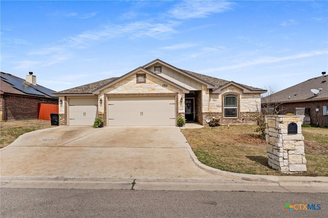 view of front of property with a garage, stone siding, driveway, and brick siding