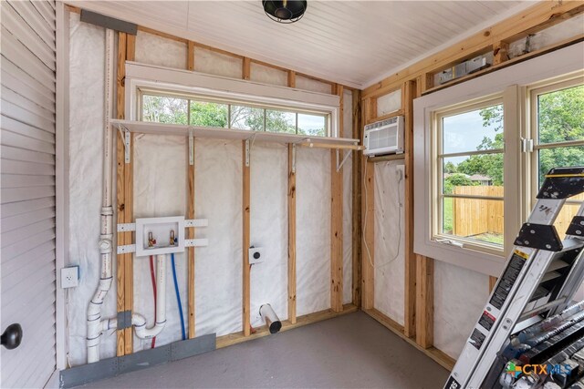 storage room featuring an AC wall unit