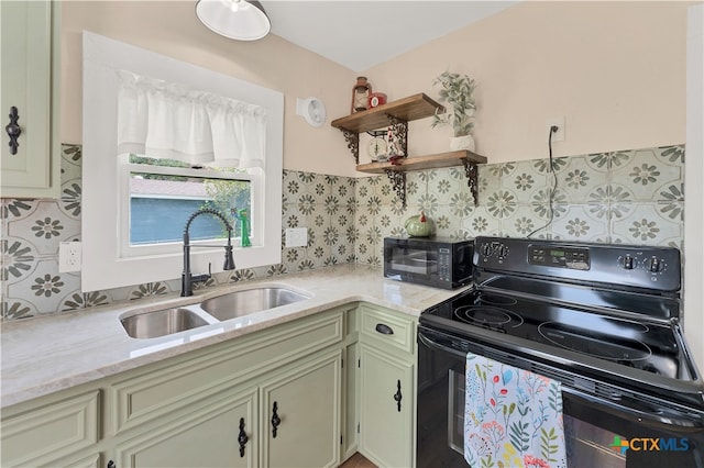 kitchen featuring light stone countertops, sink, and black appliances