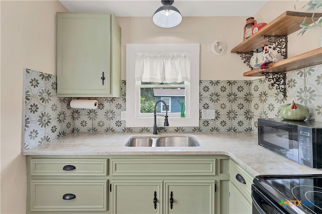 kitchen featuring green cabinets and sink