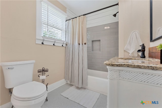 full bathroom featuring vanity, tile patterned floors, toilet, and shower / tub combo