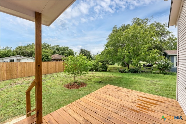 deck featuring a yard