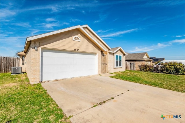 ranch-style house featuring a front lawn, cooling unit, and a garage