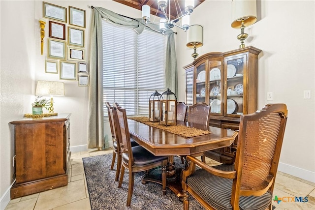 dining space featuring a chandelier and light tile patterned flooring