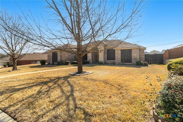 ranch-style house with a front yard