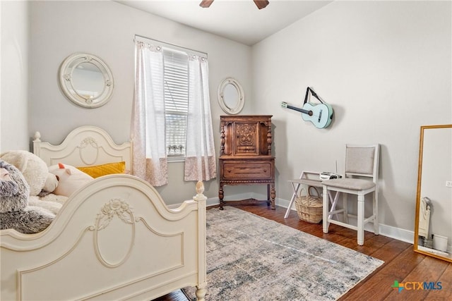 bedroom with ceiling fan and dark hardwood / wood-style floors