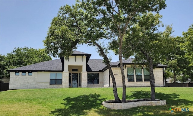 view of front of property with a front lawn