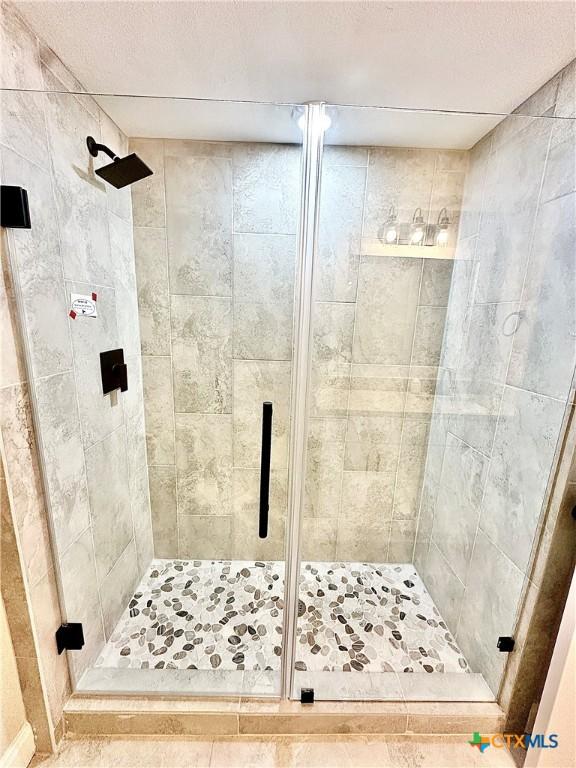 bathroom with an enclosed shower