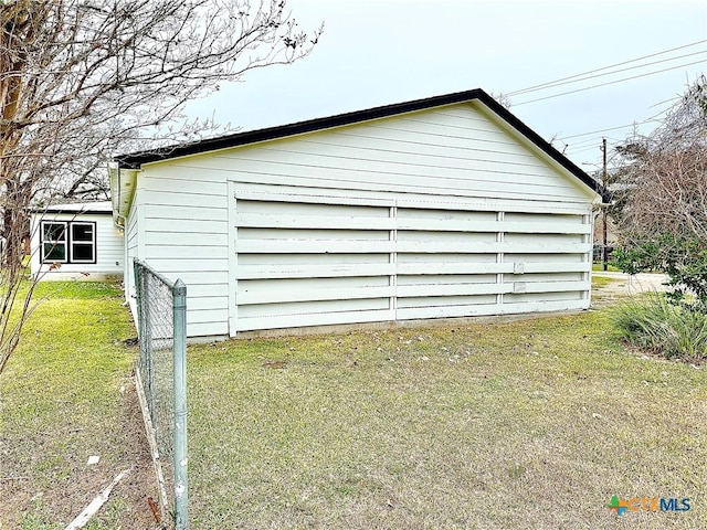 garage featuring a yard