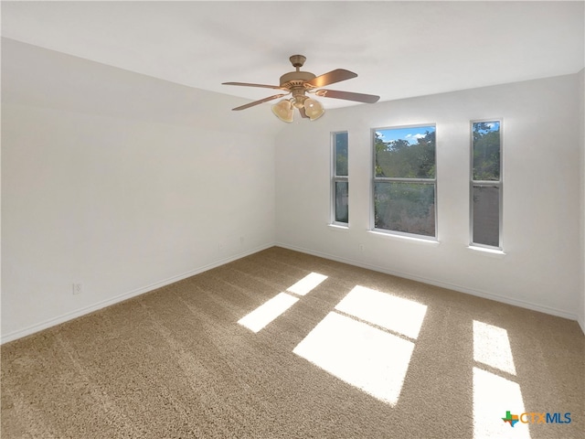 carpeted empty room with ceiling fan