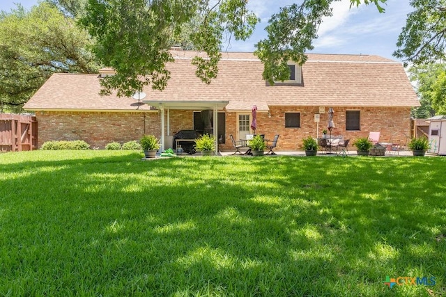 3309 Cottonwood Ln, Temple, TX 76502 - view of front of house featuring a patio, brick siding, and a shingled roof