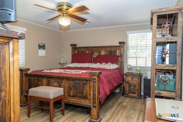 3309 Cottonwood Ln, Temple, TX 76502 - bedroom with wood finished floors and crown molding