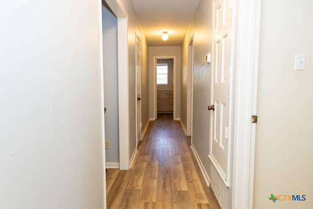 3309 Cottonwood Ln, Temple, TX 76502 - hall with light wood-type flooring and baseboards