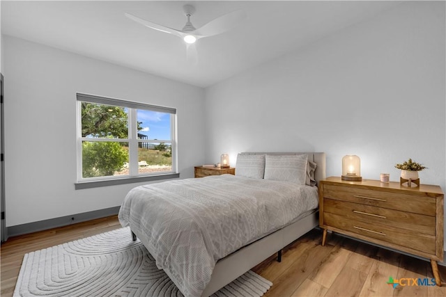 438 Cedar Mountain Dr, Marble Falls, TX 78654 - bedroom featuring wood finished floors and ceiling fan