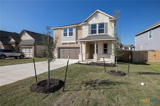 view of front of house with a front lawn and a garage