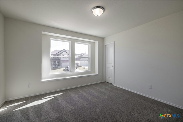 view of carpeted spare room