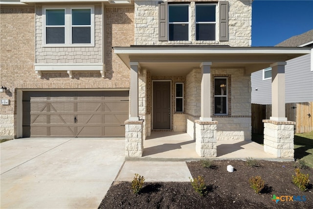 view of front facade with a porch and a garage