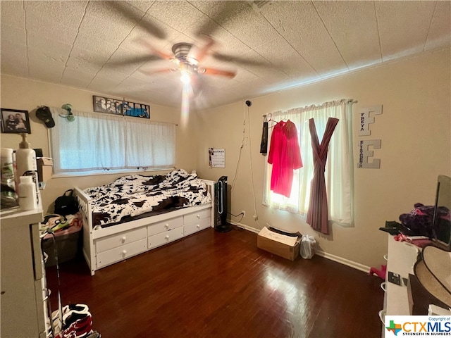 bedroom featuring dark wood-type flooring and ceiling fan